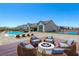 Spacious backyard with pool, fire pit, and deck at 8838 Sorrel Hills Ct, Las Vegas, NV 89113