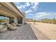 Backyard with covered patio and comfortable seating at 8838 Sorrel Hills Ct, Las Vegas, NV 89113