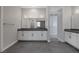 Elegant bathroom with double vanity and gray floor tiles at 8838 Sorrel Hills Ct, Las Vegas, NV 89113