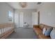 Bright and spacious Bedroom with a crib and sitting area at 8838 Sorrel Hills Ct, Las Vegas, NV 89113