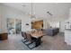 Open dining room with a live edge table and modern chandelier at 8838 Sorrel Hills Ct, Las Vegas, NV 89113