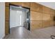 Modern entryway with wood wall accents and tile flooring at 8838 Sorrel Hills Ct, Las Vegas, NV 89113