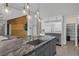 Modern kitchen with stainless steel appliances and a large island at 8838 Sorrel Hills Ct, Las Vegas, NV 89113