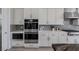 Modern kitchen with stainless steel appliances and a large island at 8838 Sorrel Hills Ct, Las Vegas, NV 89113