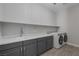 Laundry room with modern washer, dryer, and cabinets at 8838 Sorrel Hills Ct, Las Vegas, NV 89113