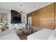 Modern living room with wood feature wall and fireplace at 8838 Sorrel Hills Ct, Las Vegas, NV 89113