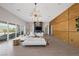 Spacious living room featuring a modern fireplace and large windows at 8838 Sorrel Hills Ct, Las Vegas, NV 89113
