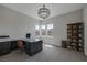 Bright home office with built-in shelving and large windows at 8838 Sorrel Hills Ct, Las Vegas, NV 89113