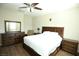 Main bedroom with wood floors and ceiling fan at 8959 Fox Season Ave, Las Vegas, NV 89178