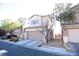 Two-story house with attached garage and landscaping at 8959 Fox Season Ave, Las Vegas, NV 89178