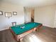 Game room featuring a pool table and hardwood floors at 8959 Fox Season Ave, Las Vegas, NV 89178