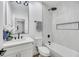 Modern bathroom with white vanity, bathtub, and updated fixtures at 9100 Kings Town Ave, Las Vegas, NV 89145