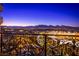 Night balcony view with city lights and mountain backdrop at 9101 Alta Dr # 903, Las Vegas, NV 89145