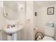 Clean bathroom with pedestal sink and toilet at 9785 Gallo Dr, Las Vegas, NV 89147