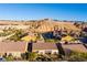 Aerial view of houses nestled in a desert landscape with mountain views at 993 Starlight Terrace Way, Mesquite, NV 89034