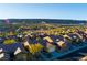 Community overview showcasing numerous houses with tile roofs and desert landscaping at 993 Starlight Terrace Way, Mesquite, NV 89034