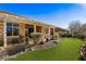 Landscaped backyard with covered patio and fountain at 993 Starlight Terrace Way, Mesquite, NV 89034
