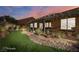 Landscaped backyard with pergola, artificial turf and stone accents at 993 Starlight Terrace Way, Mesquite, NV 89034