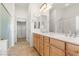 Elegant bathroom with double sinks, walk-in shower, and large closet at 993 Starlight Terrace Way, Mesquite, NV 89034