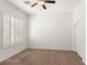 Spacious bedroom with large windows and ceiling fan at 993 Starlight Terrace Way, Mesquite, NV 89034