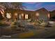Beautiful desert landscaping surrounds this one-story home with a Spanish-style facade at 993 Starlight Terrace Way, Mesquite, NV 89034