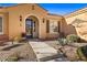 Front entry with arched entryway and decorative accents at 993 Starlight Terrace Way, Mesquite, NV 89034