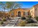 One-story house with a welcoming front porch and nicely landscaped yard at 993 Starlight Terrace Way, Mesquite, NV 89034