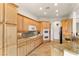 Modern kitchen with granite counters, stainless steel appliances, and light wood cabinets at 993 Starlight Terrace Way, Mesquite, NV 89034