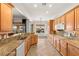 Kitchen with granite counters, stainless steel appliances, and tile floors at 993 Starlight Terrace Way, Mesquite, NV 89034