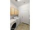 Functional laundry room with washer, dryer, and storage at 993 Starlight Terrace Way, Mesquite, NV 89034