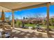 Covered patio with seating area and mountain views at 993 Starlight Terrace Way, Mesquite, NV 89034