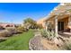 Covered patio with seating area and mountain views at 993 Starlight Terrace Way, Mesquite, NV 89034