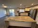 Modern kitchen with white cabinets, stainless steel appliances and granite countertops at 110 La Padania Ave, Las Vegas, NV 89183