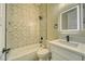 Bathroom with a tub, decorative tile backsplash, and modern vanity with an illuminated mirror at 1131 Blackhorn St, Pahrump, NV 89048