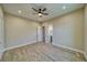 Minimalist bedroom featuring a ceiling fan, recessed lighting, and a door to the bathroom at 1131 Blackhorn St, Pahrump, NV 89048