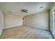 Spacious bedroom features wood-look flooring, an exit to the exterior, and a ceiling fan at 1131 Blackhorn St, Pahrump, NV 89048