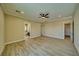 Bedroom with wood-look tile flooring and neutral walls and an ensuite bathroom at 1131 Blackhorn St, Pahrump, NV 89048