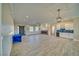 Expansive living room with tile flooring, fireplace, bar, and ample natural light at 1131 Blackhorn St, Pahrump, NV 89048