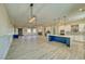 Open-concept living space with a kitchen, dining, and living area, featuring modern finishes and ample natural light at 1131 Blackhorn St, Pahrump, NV 89048