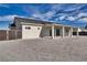 Rear exterior with a covered patio and low-maintenance landscaping at 1131 Blackhorn St, Pahrump, NV 89048