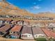 Community view showcasing homes with mountain backdrop at 11707 Hatchling Ave, Las Vegas, NV 89138