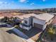 Modern home with desert landscaping and city views in a new community at 11707 Hatchling Ave, Las Vegas, NV 89138