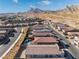 Community view showcasing homes with mountain backdrop at 11707 Hatchling Ave, Las Vegas, NV 89138
