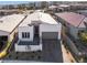 Modern single-story home with attached garage and brick driveway at 11707 Hatchling Ave, Las Vegas, NV 89138