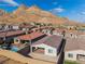 Aerial view of house, pool, and backyard; mountains in the distance at 11707 Hatchling Ave, Las Vegas, NV 89138