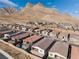 Community view showcasing homes with mountain backdrop at 11707 Hatchling Ave, Las Vegas, NV 89138