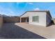 Large backyard with gravel and a covered patio at 11707 Hatchling Ave, Las Vegas, NV 89138