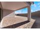 Covered patio with brick pavers and desert landscaping at 11707 Hatchling Ave, Las Vegas, NV 89138