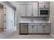 Modern basement kitchenette with stainless steel appliances at 11707 Hatchling Ave, Las Vegas, NV 89138