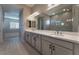 Spa-like bathroom with double vanity and a large, glass-enclosed shower at 11707 Hatchling Ave, Las Vegas, NV 89138